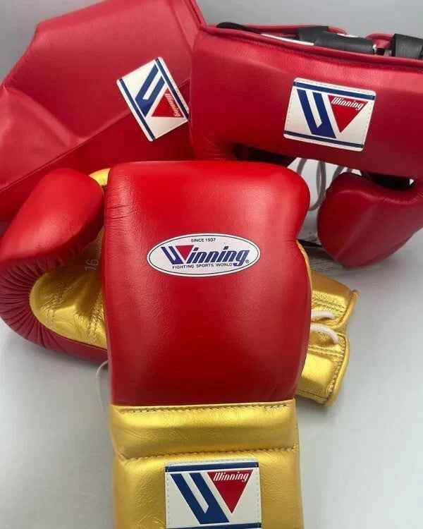 Winning custom professional sparring set in red and gold leather including MS-600 lace-up gloves, FG-2900 headgear, and CPS-500 protector.