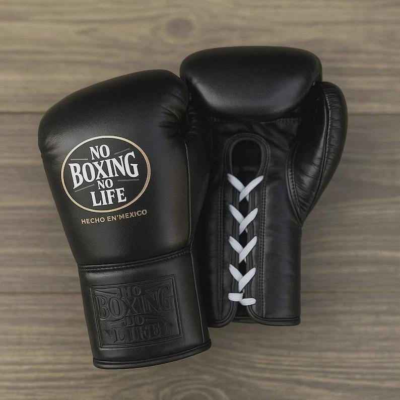 https://gemini.google.com/u/1/app/896bfb9b7d875540#:~:text=No%20Boxing%20No%20Life%20professional%20lace%2Dup%20boxing%20gloves%20in%20black%20leather%20featuring%20a%20gold%2Dfoiled%20brand%20logo%20and%20contrasting%20white%20laces.