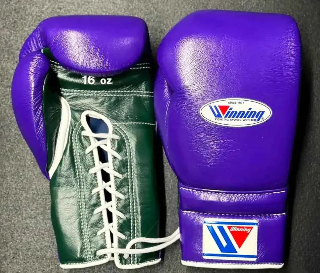 Custom Winning professional 16oz lace-up boxing gloves featuring a royal purple leather striking face and thumb paired with a rich dark green leather palm and white laces.