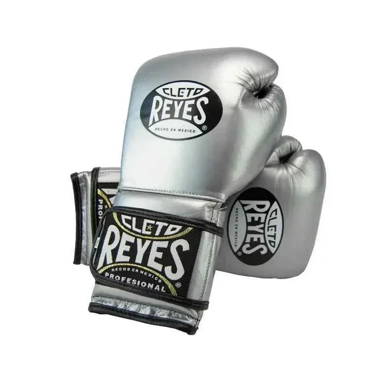 Official Cleto Reyes professional hook-and-loop training boxing gloves in silver metallic leather featuring a high-sheen chrome finish, black inner thumb lining, and traditional brand patches.