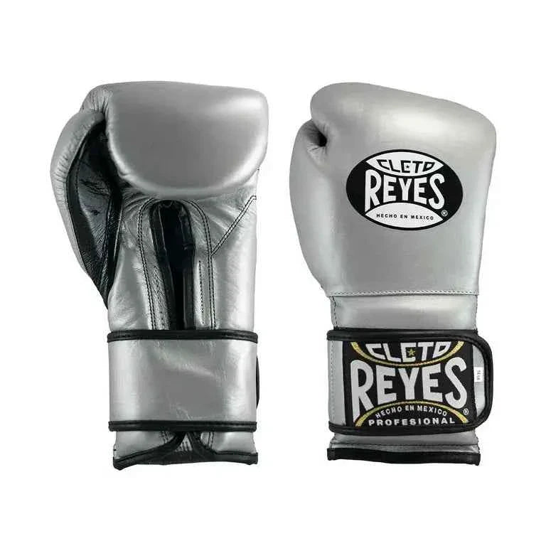 Official Cleto Reyes professional hook-and-loop training boxing gloves in silver metallic leather featuring a high-sheen chrome finish, black inner thumb lining, and traditional brand patches.