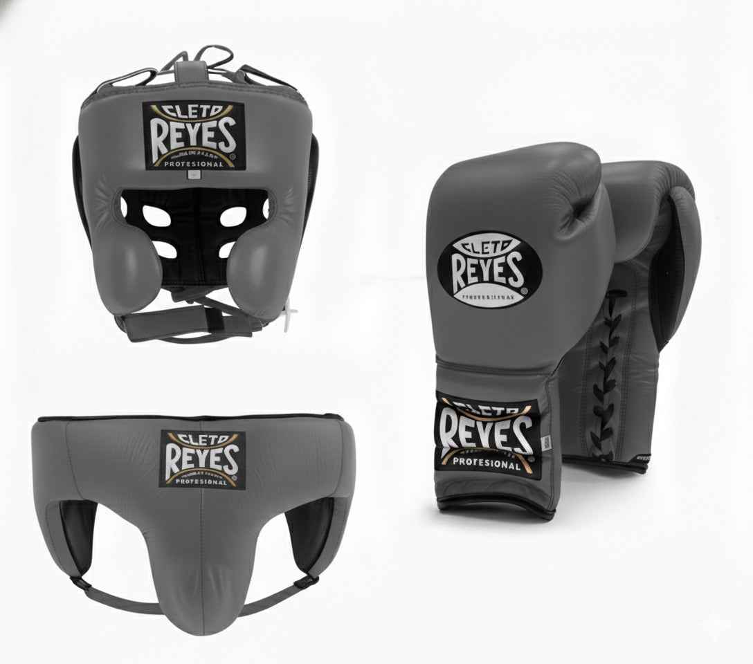 Official Cleto Reyes professional 3-piece boxing sparring gear set featuring matching lace-up gloves, a cheek protector headguard, and a groinguard in uniform slate gray leather.