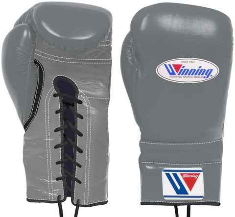 Custom Winning professional lace-up boxing gloves in slate gray leather featuring official brand patches, black trim accents, and contrasting black laces.