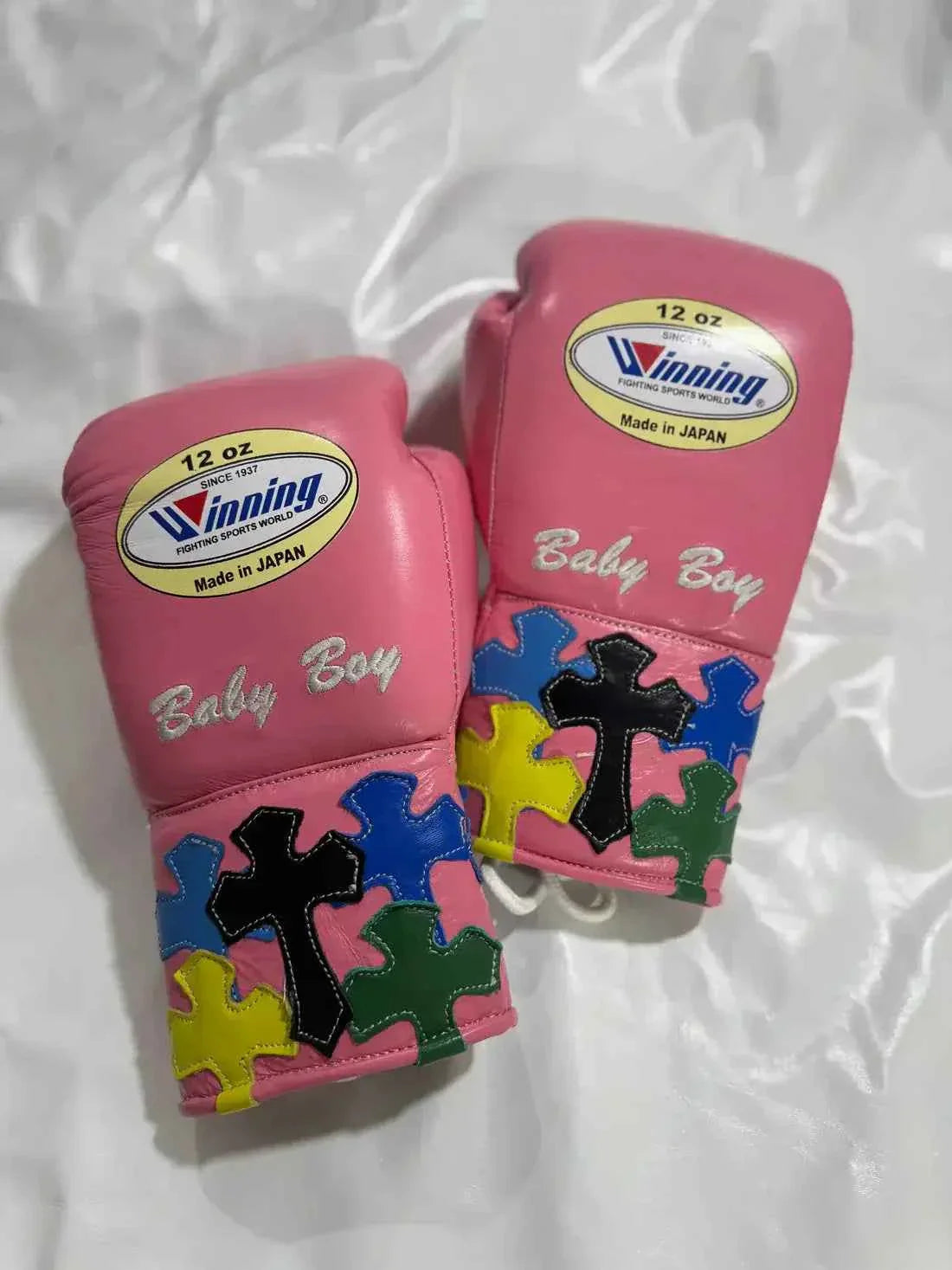 Winning MS-400 custom professional 12oz lace-up boxing gloves in pink leather featuring multi-color cross patches handcrafted in Japan.