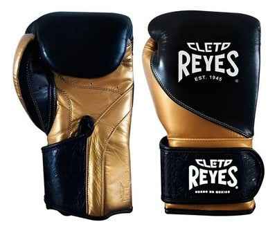 Special edition Cleto Reyes professional hook-and-loop training boxing gloves in black and gold leather featuring a printed heritage pattern on the wrist cuffs.