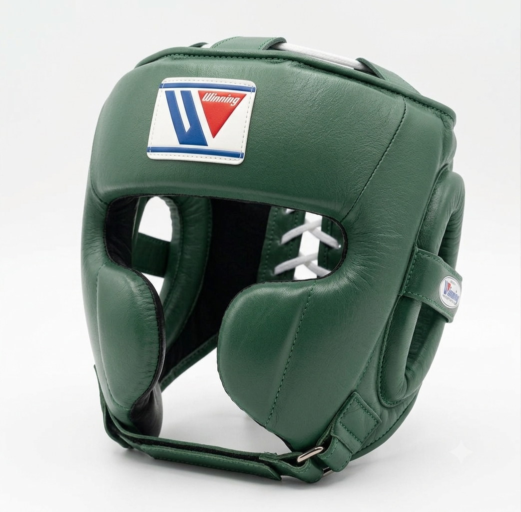 A dark green leather boxing headguard with a white, blue, and red logo patch on the forehead, shown on a light gray background.