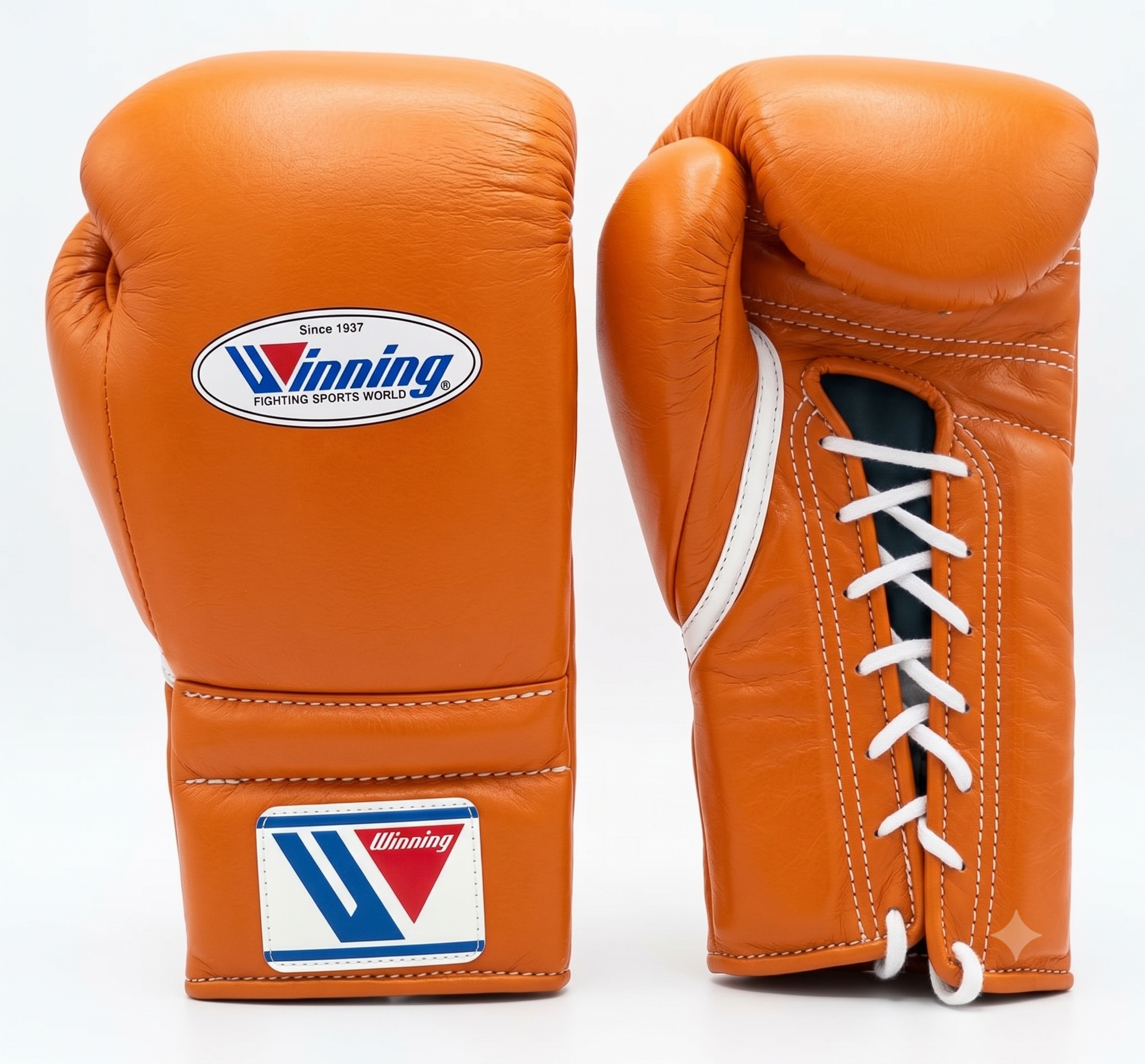 Two orange leather boxing gloves shown on a white background, one displaying the front with a white and blue Winning logo patch, and the other showing the side with white laces.