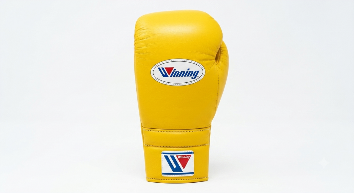 Winning classic yellow leather lace-up boxing training glove standing upright
