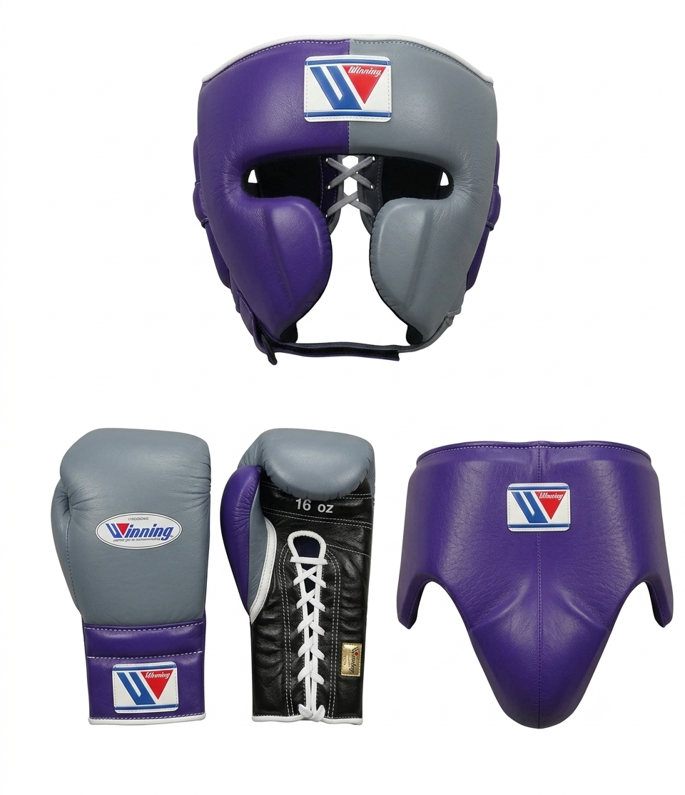 A set of boxing protective gear on a plain white background, including a purple and gray headguard, a pair of gray and purple boxing gloves, a black-and-purple laced mouthguard, and a purple groin guard. The headguard and gloves show a visible Winning brand logo.