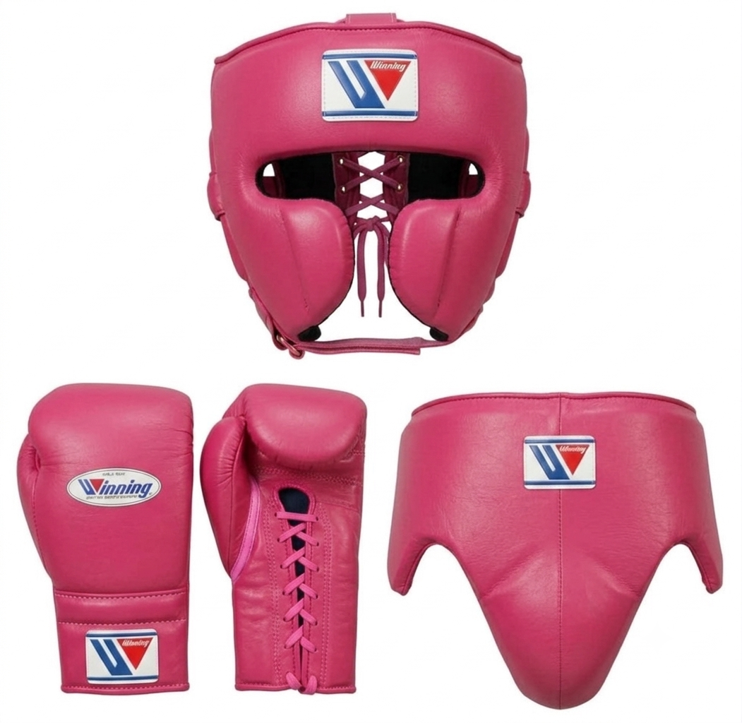 Pink boxing gear set including a headguard, boxing gloves, and a shin guard, shown on a plain white background. The Victorious brand logo is visible on the gear.