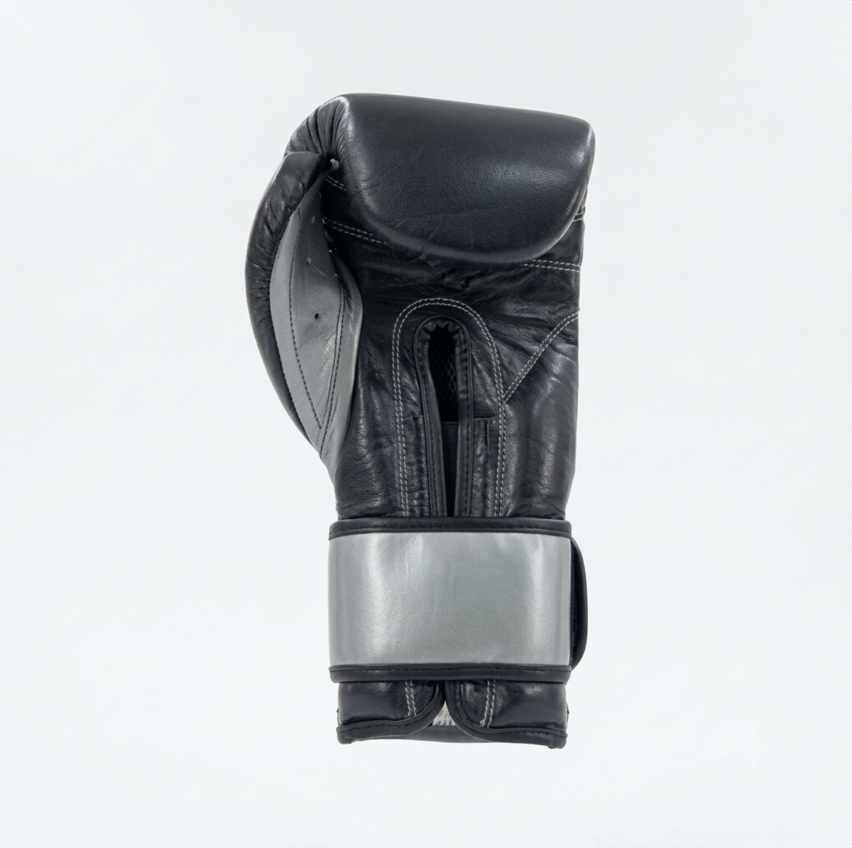 Cleto Reyes black leather boxing glove side view showing metallic silver cuff detail