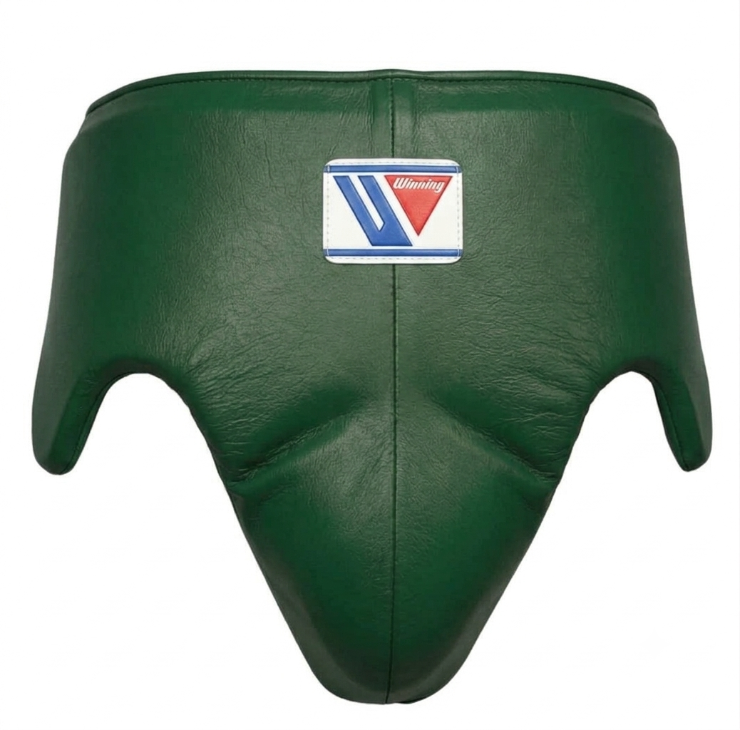 A dark green leather boxing headguard with a central stitched seam and a white, blue, and red 'Viking' brand patch on the front, set against a plain white background.