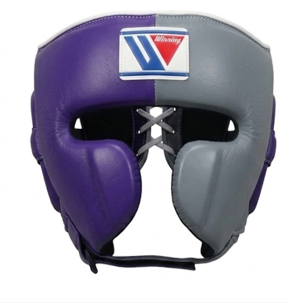 A split-color boxing headguard in purple and gray with a white, blue, and red Winning logo patch on the forehead, shown against a plain white background.