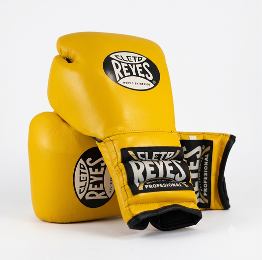 Three Cleto Reyes yellow boxing gloves stacked showing brand logo on knuckle and wrist strap