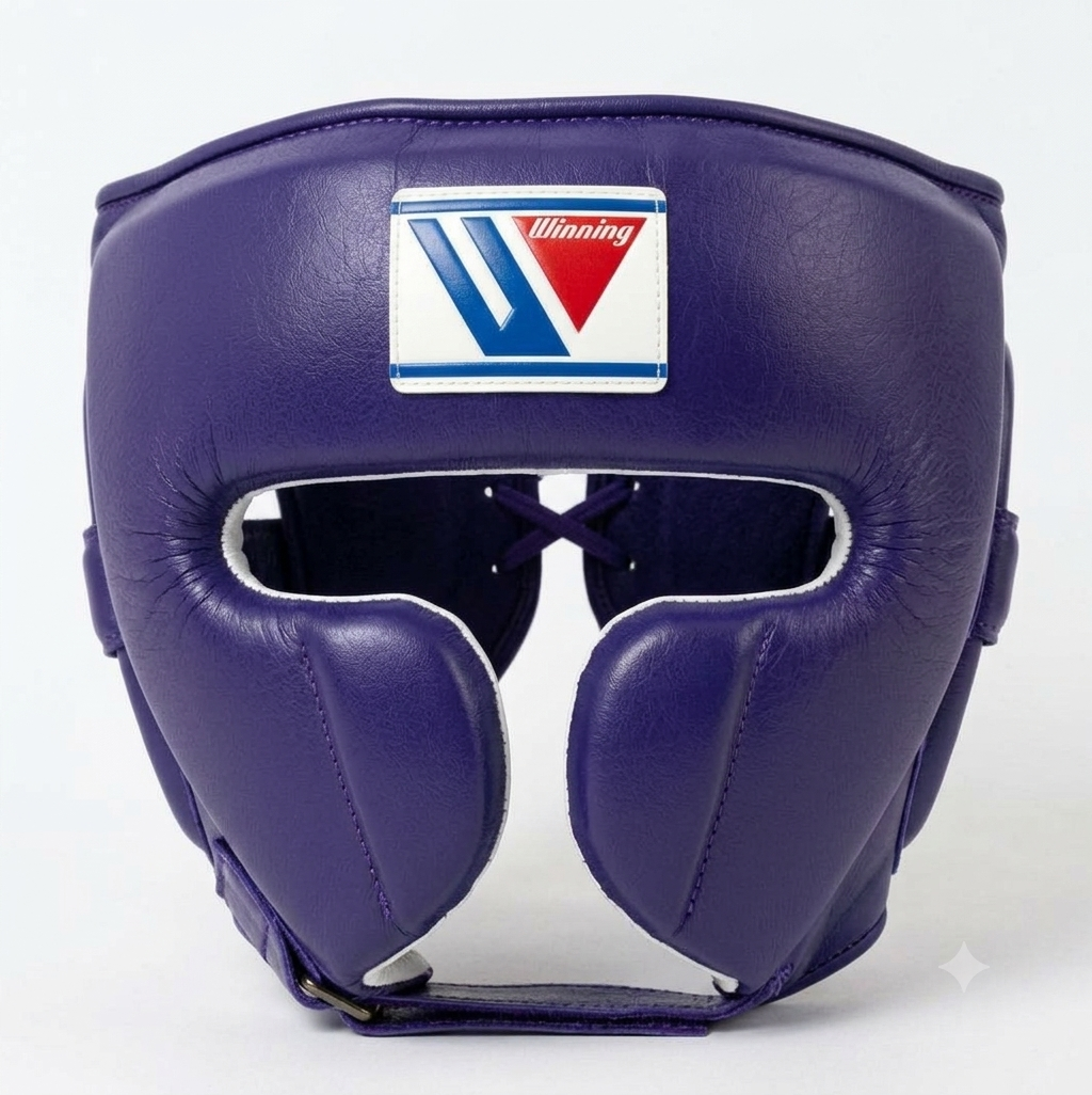 A purple leather boxing headguard with a white, blue, and red Winning brand logo patch on the forehead, shown against a plain white background.