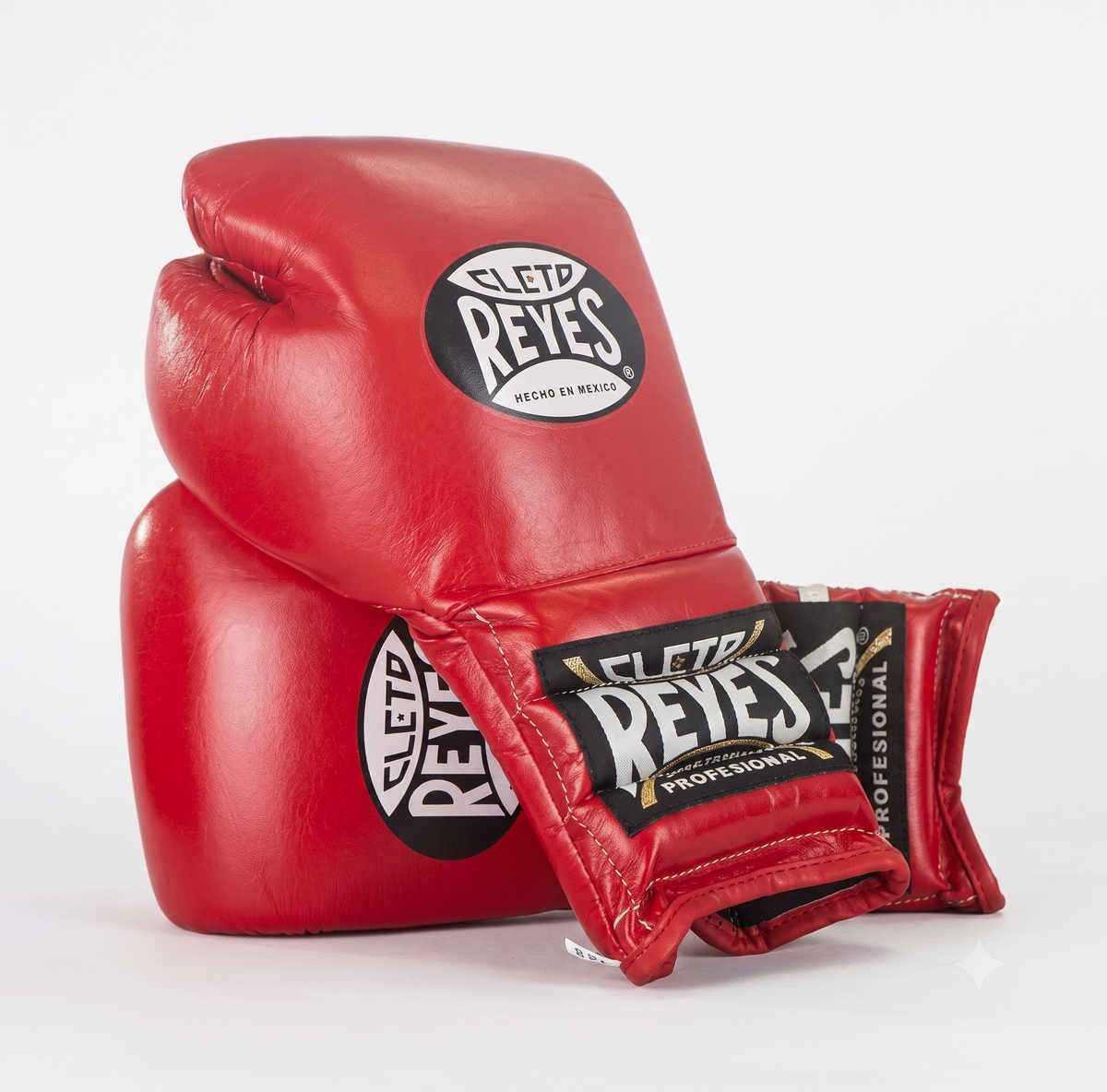 Cleto Reyes red leather boxing gloves pair stacked with brand patches on back and wrist