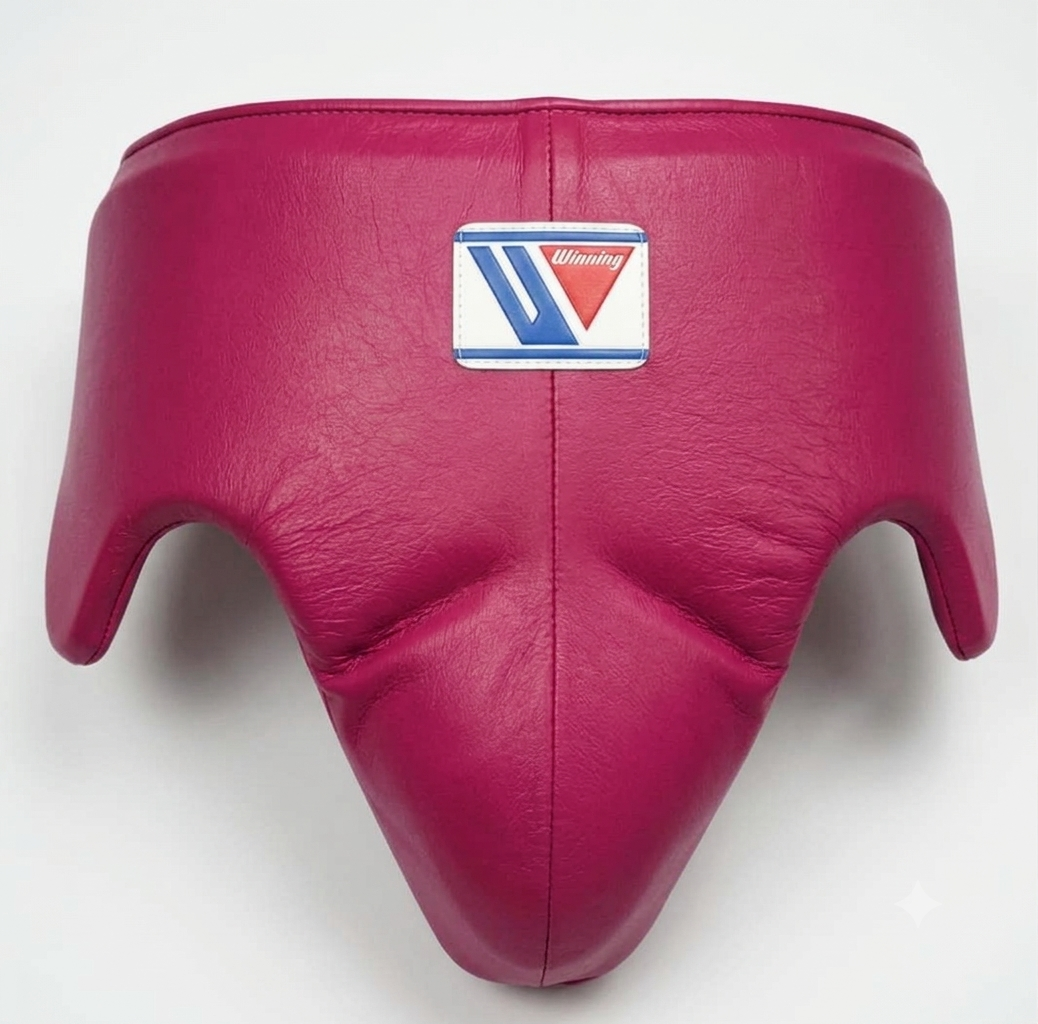A magenta pink leather boxing headguard with a central logo patch for 'Viking' on a white background.
