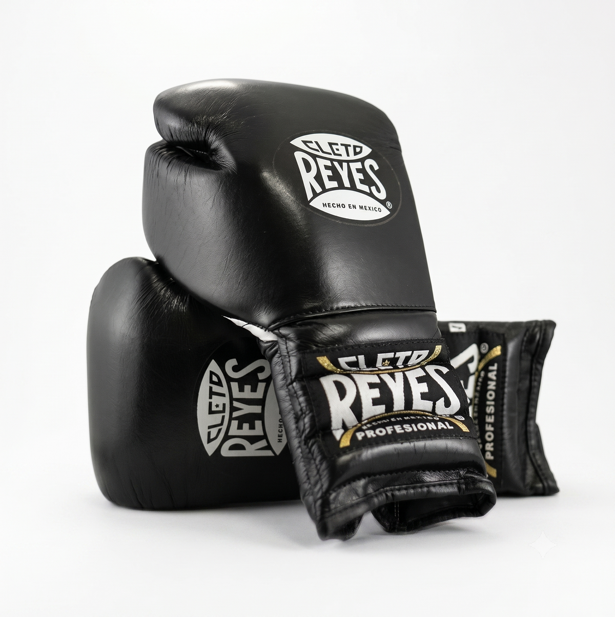 Cleto Reyes black boxing gloves pair with white and gold branding