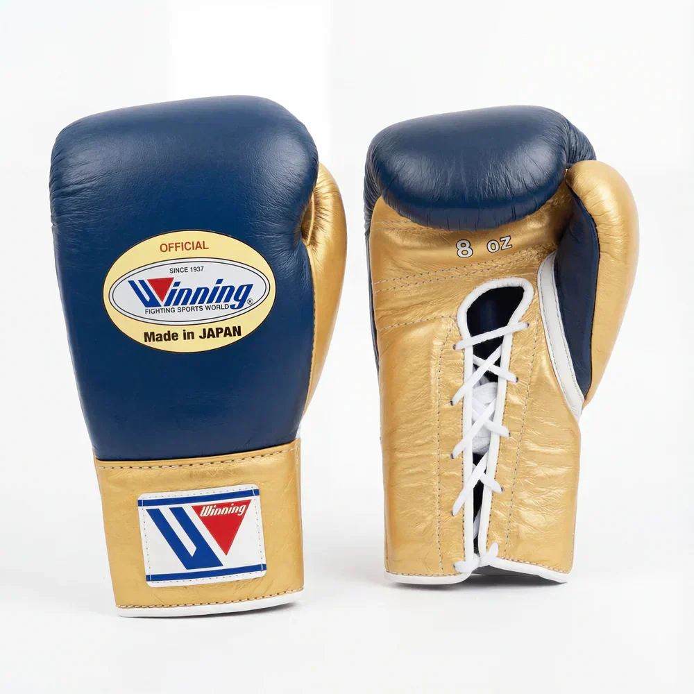 Authentic navy blue and metallic gold Winning professional boxing gloves handcrafted in Japan with official branding.