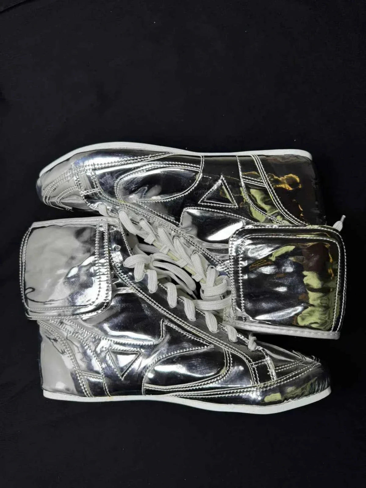 Close-up of metallic silver custom boxing boot lacing and upper