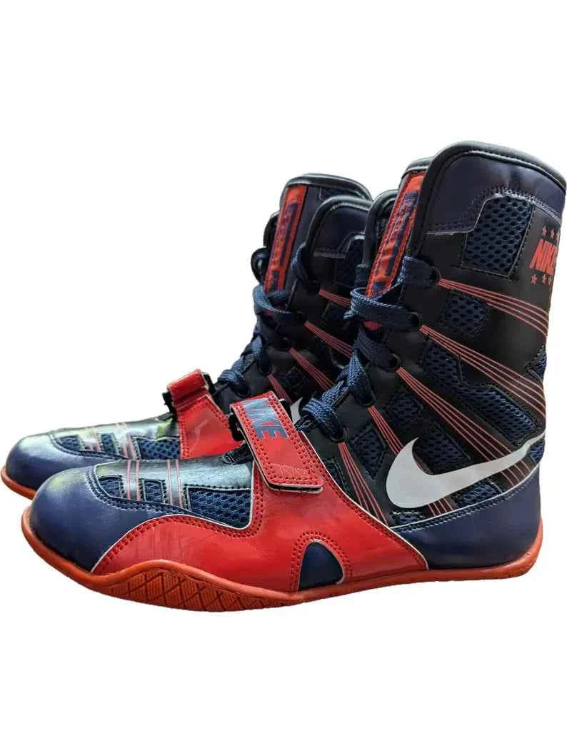 Professional Nike Hyperko 1 boxing boots in vibrant red and navy blue featuring Flywire support and a forefoot strap.