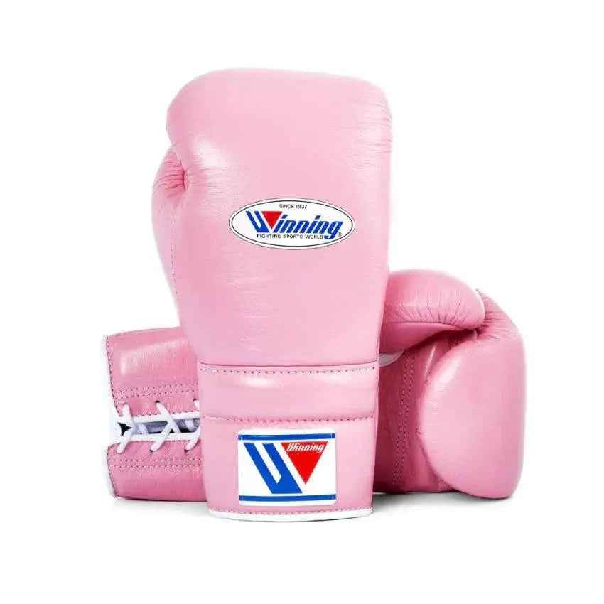 Official Winning professional lace-up training boxing gloves in premium pink leather featuring white laces, a white contrast lacing border, and the iconic brand logo crest on the cuffs.
