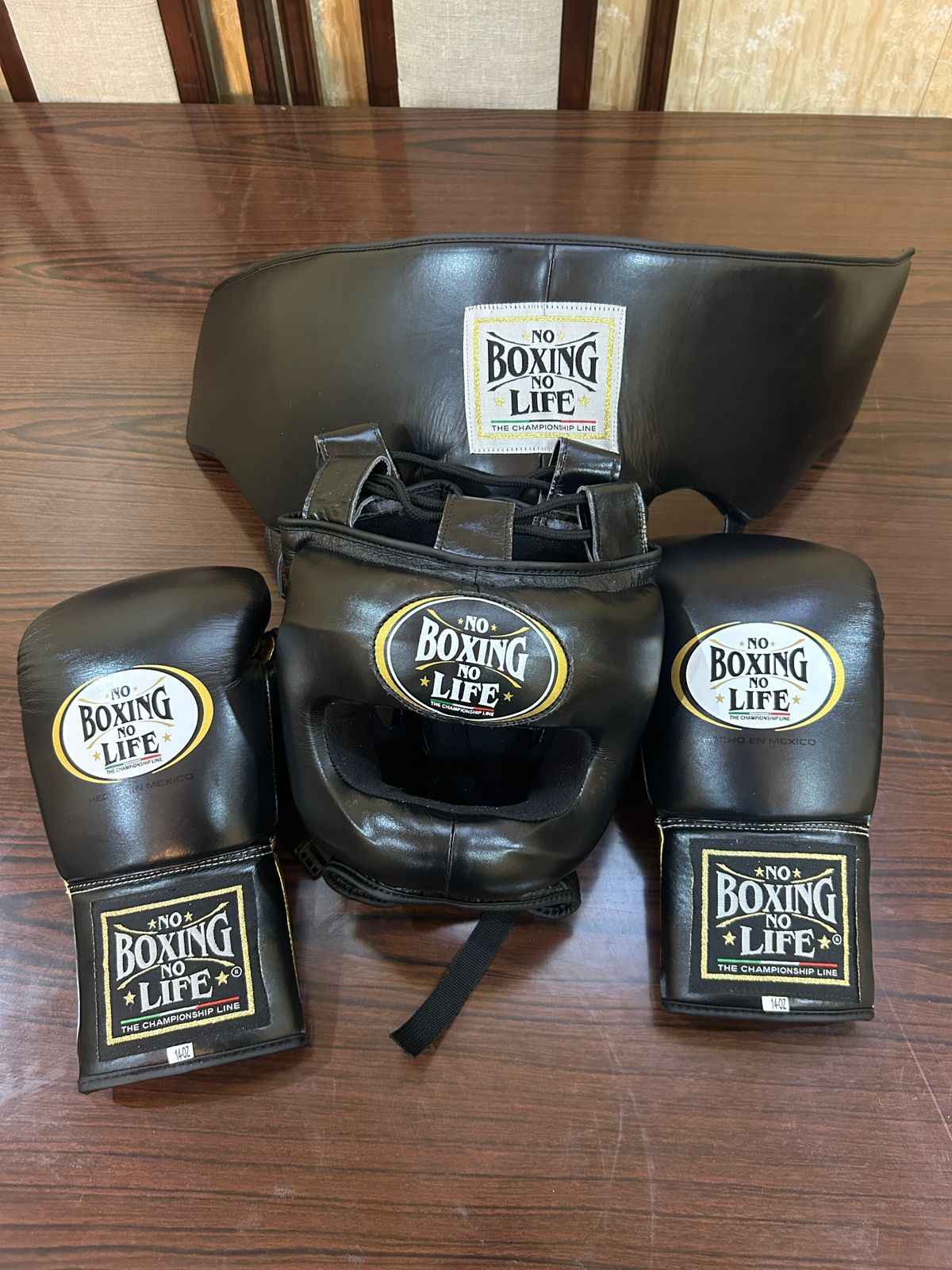 No Boxing No Life custom professional sparring set in matte black leather including lace-up gloves, headgear, and groin protector.