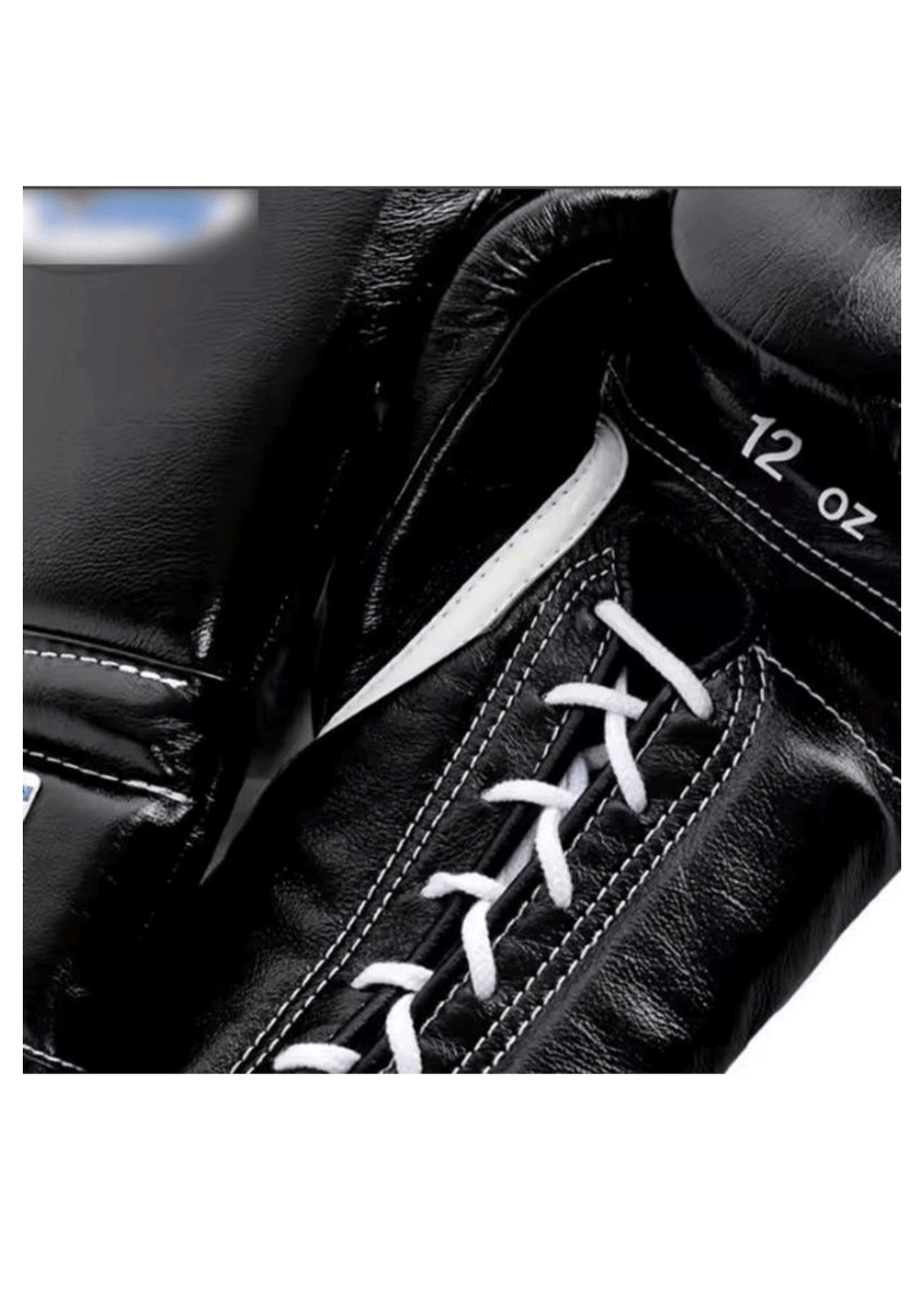Close-up of Winning classic black leather lace-up boxing glove showing white laces