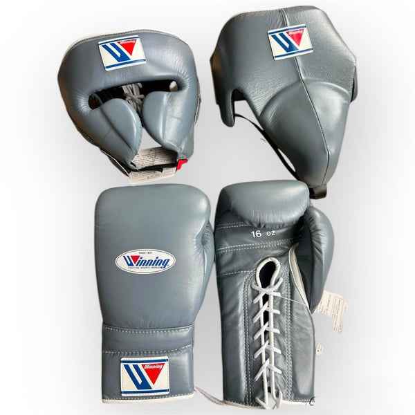 Official Winning professional 3-piece boxing sparring gear set in a matching matte gray premium leather layout, including 16 oz lace-up gloves, a face guard headgear, and a groin protector over a white background.