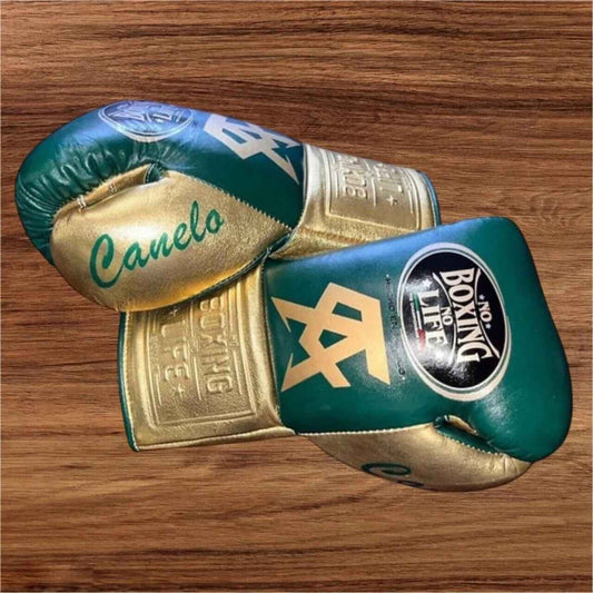 Dark green leather gloves with metallic gold palm and white laces