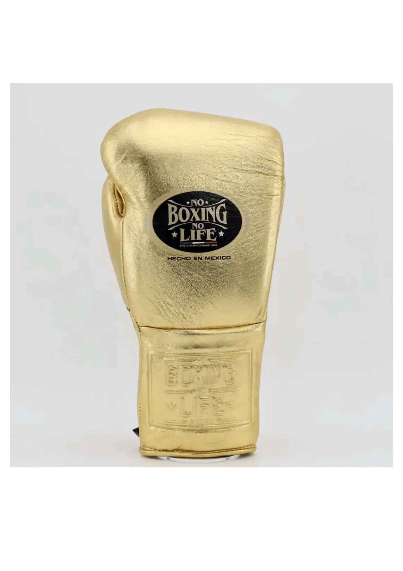 Official No Boxing No Life professional lace-up boxing gloves in metallic gold leather showing the iconic black oval brand logo patch on the knuckles and an embossed logo on the cuff.