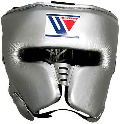 Custom Winning FG-2900 professional boxing headguard in metallic silver leather with official branding and streamlined cheek protectors.