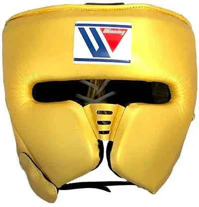 Custom Winning FG-2900 professional boxing headguard in metallic gold leather with official branding and streamlined cheek protectors.