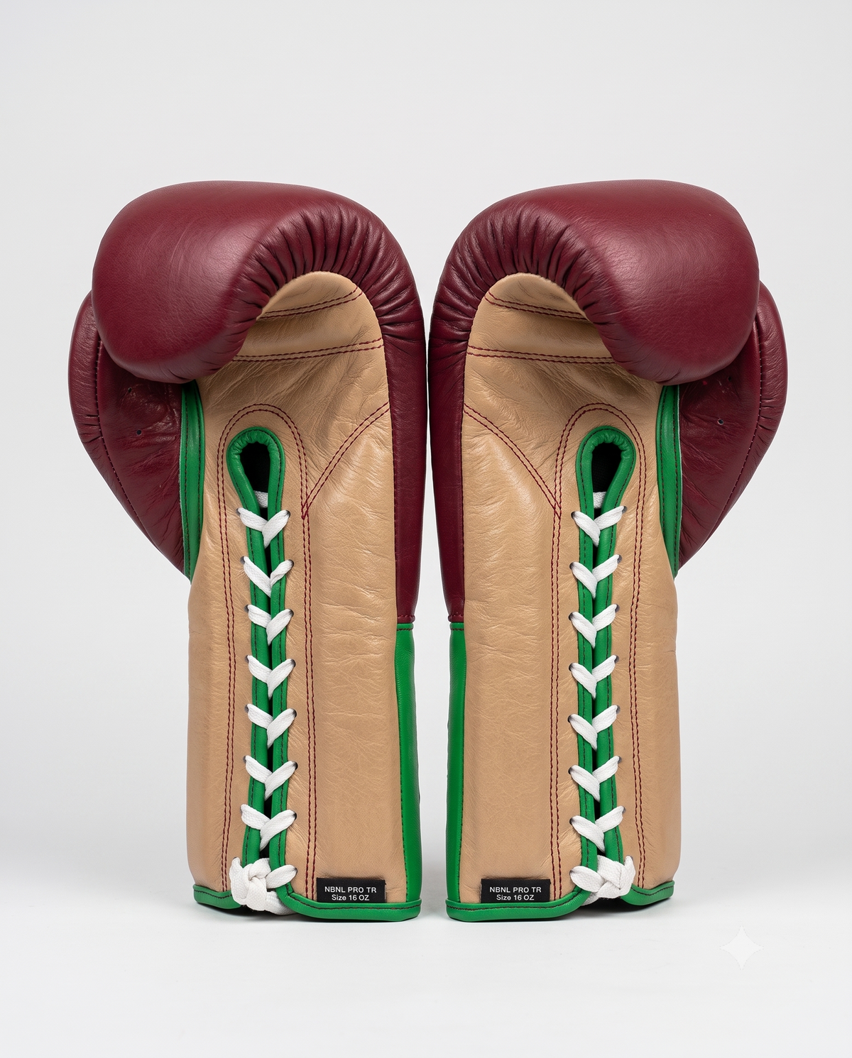 Maroon sparring gloves side view showing padded knuckle area