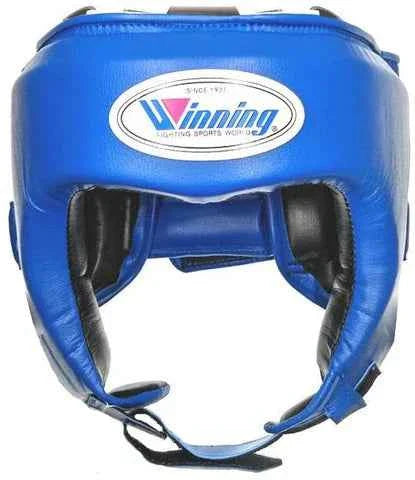 Winning FG-2900 professional boxing headguard in royal blue leather with official branding logo and streamlined cheek protection.