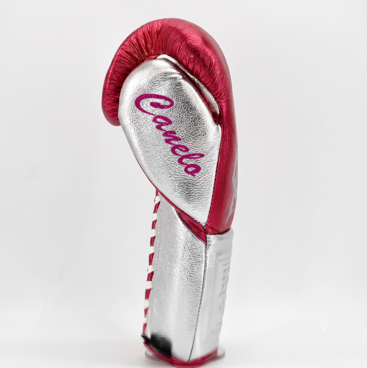 Close-up of silver and pink metallic leather glove trim detail