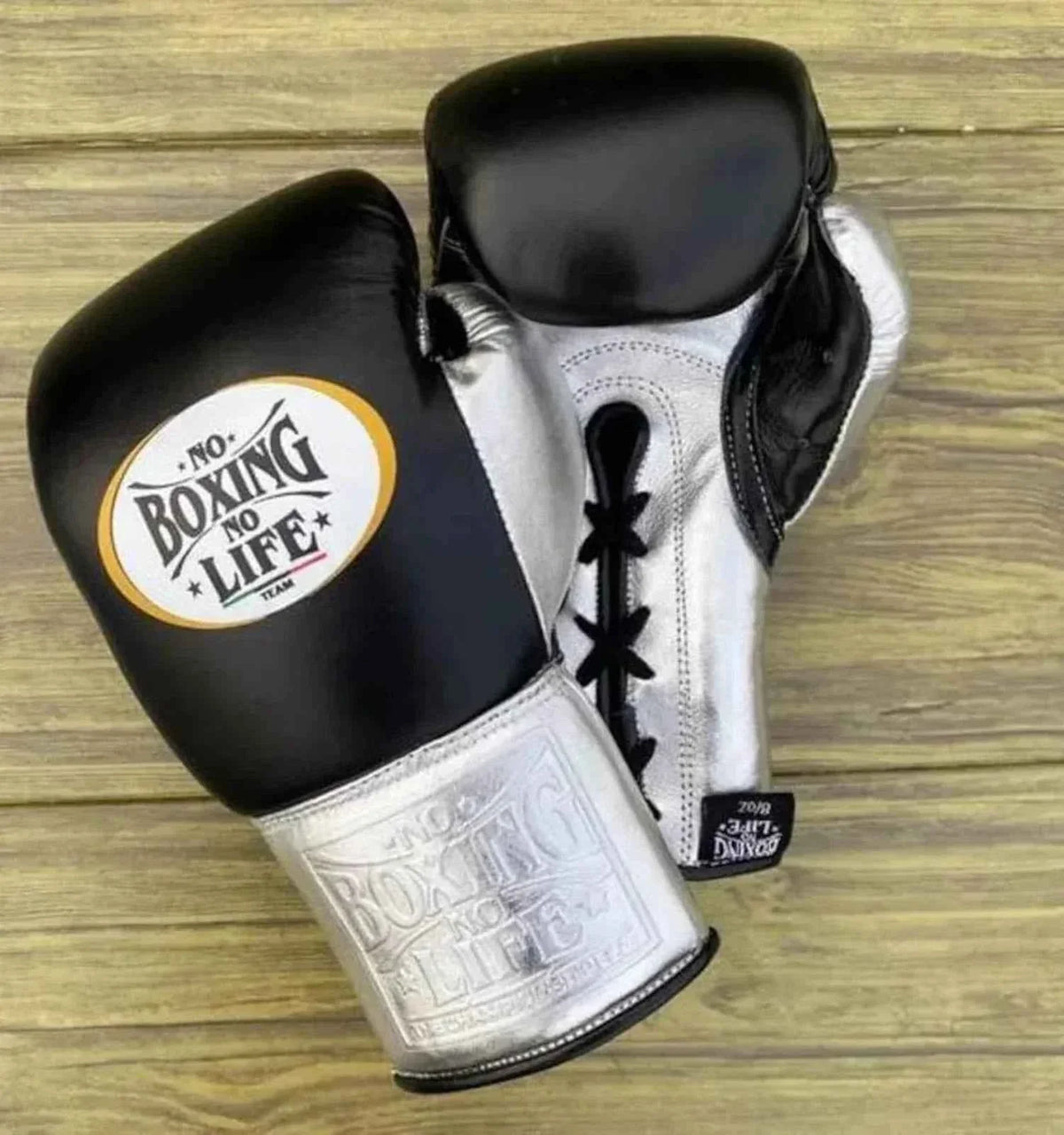 No Boxing No Life custom professional lace-up boxing gloves in black leather with metallic silver cuffs and palms.