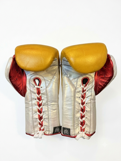 Metallic silver and red glove with mustard yellow padding detail