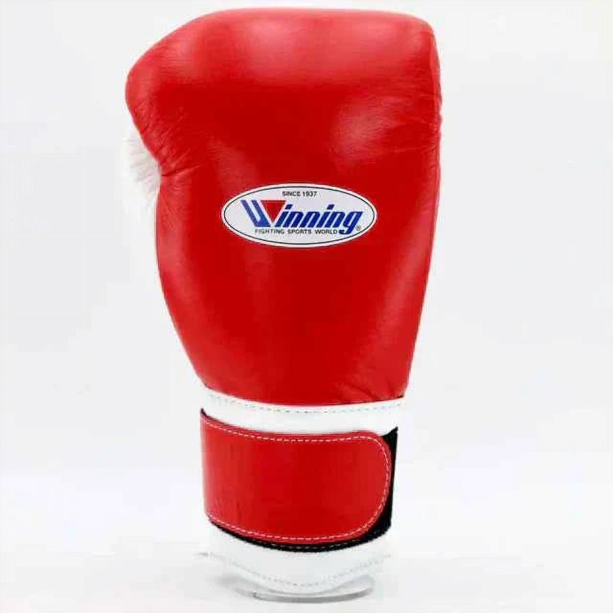 Side view of red and white Winning boxing gloves showing wrist closure and padding