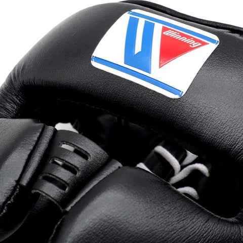 Black boxing glove with a visible brand logo on a white background