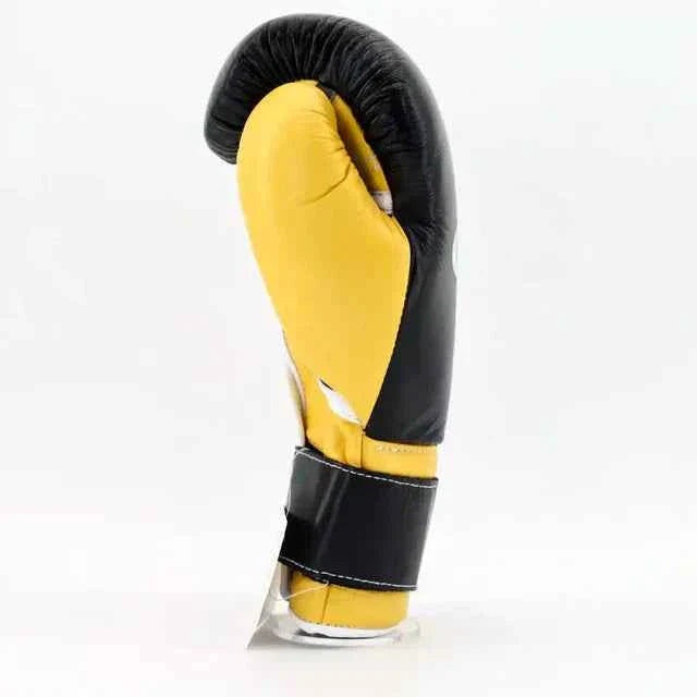 Yellow boxing glove with black accents on a white background